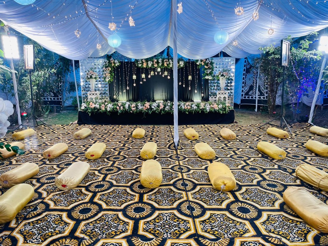 Blue mirror-tile mehndi lounge with gold bolster cushions by Events by Momin, mehndi decor company in Liaqatpur