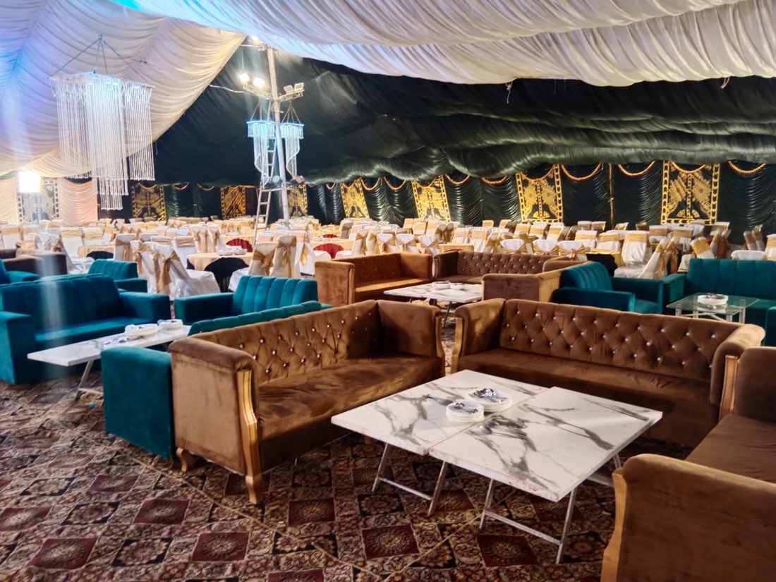 Luxury teal and brown velvet guest lounge seating inside a wedding tent by Events by Momin, event decorator in Rahim Yar Khan